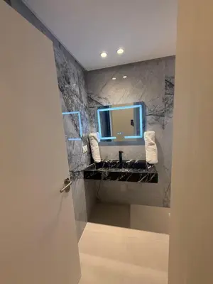 a bathroom with a sink and a mirror at Appartement moderne in Marrakech