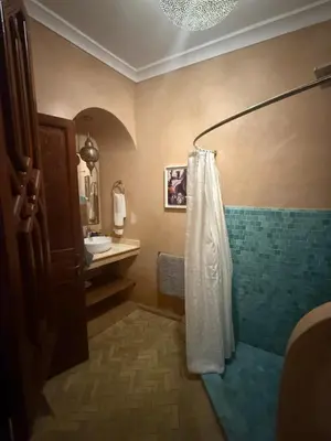 a bathroom with a shower and a sink at Riad Jamaique - Marrakech in Marrakech