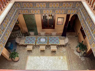 an overhead view of a dining room with a table and chairs at Riad Jamaique - Marrakech in Marrakech