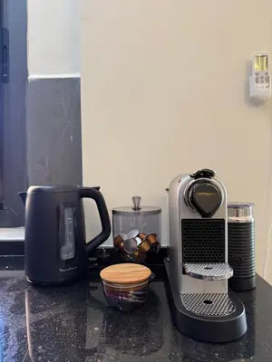 a kitchen counter with a coffee maker and a toaster at Elegant & Cozy Stay in Center in Marrakech