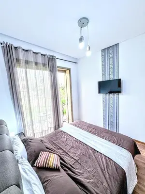 a bedroom with a bed and a window at The Golf Pool Gardens in Marrakech