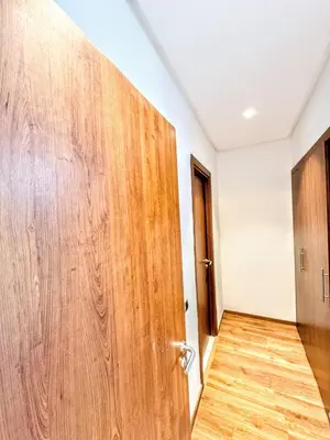 a wooden door in a room with a wooden floor at The Golf Pool Gardens in Marrakech