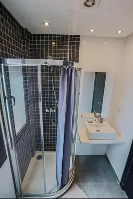 a bathroom with a shower and a sink at Generosa studio in Marrakech