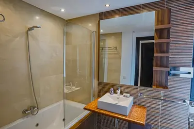 a bathroom with a sink and a shower at Generosa studio in Marrakech
