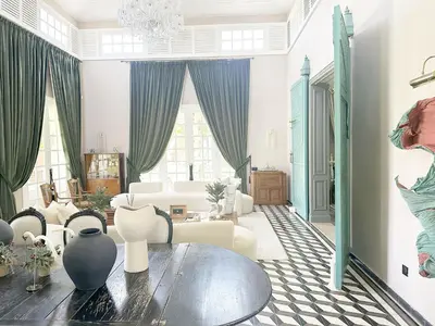a living room with a table and a couch at Yasira in Marrakech