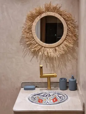 a bathroom with a sink with a mirror over it at Entire Luxury Duplex Appart 3Bedroom 2Living Rooms in Top Center in Marrakech