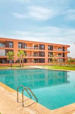 a large swimming pool in front of a building at Noria Isli Dar Noor in Marrakech
