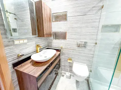 a bathroom with a sink and a toilet at Villa with private pool in Marrakech