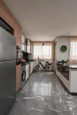 a kitchen with a bike parked in the middle of it at 3Br 2Ba Apartment in Marrakech in Marrakech