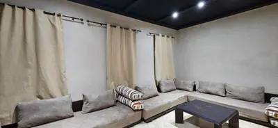 a living room with a couch and a table at Riad-Style Villa in Marrakech in Marrakech
