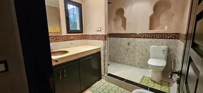 a bathroom with a toilet and a sink at Riad-Style Villa in Marrakech in Marrakech