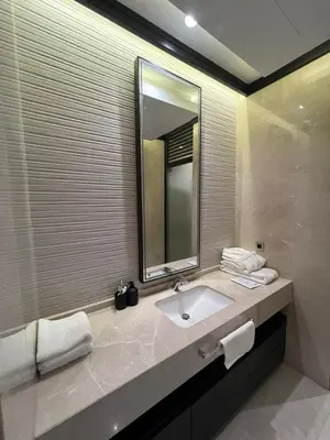 a bathroom with a sink and a mirror at Four Seasons Residences Marrakech in Marrakech