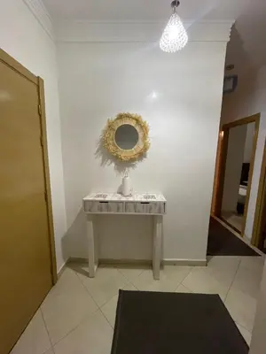 a mirror sitting on a table in a room at Appartement in Marrakech