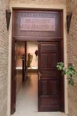 an entrance to a building with a sign above a door at Jassman2 in Marrakech
