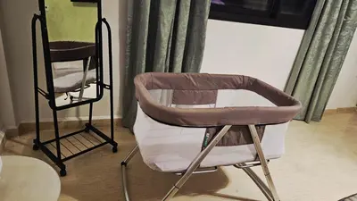 a chair and a mirror in a room at Magnifique villa avec bassin près de la Médina in Marrakech
