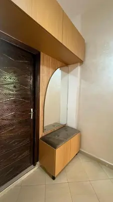 a room with a bench next to a door at Résidence touristique Marrakesh in Marrakech