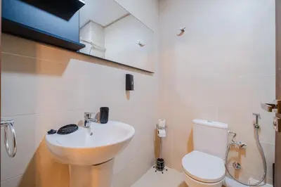 a bathroom with a sink and a toilet at 3BR Luxury Stay - Hivernage- Pool View - Parking Near M Avenue & Rail in Marrakech