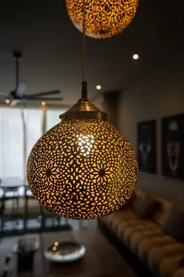 a large chandelier hanging from the ceiling in a living room at jacuzzi, 2 pools, luxury villa in Marrakech