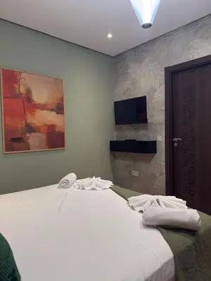 a bedroom with a bed with towels on it at Magnifique appart Moderne 2ch 4pax Tout Confort in Marrakech