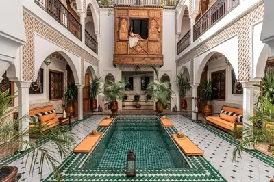 an indoor pool in the lobby of a building at Marrakech Riads, NL Collection in Marrakech