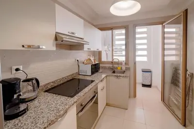 a kitchen with a sink and a counter top at Prestige de luxe avec piscine in Marrakech