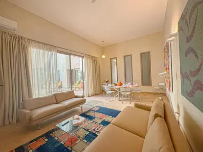 a living room with a couch and a table at Riad Timija in Marrakech