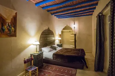 a bedroom with a bed in a room at Riad Light Of Sun in Marrakech