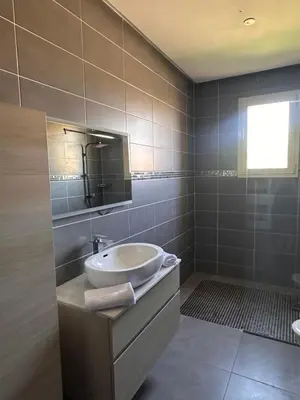 a bathroom with a sink and a mirror at Villa luxueuse marrakech in Marrakech