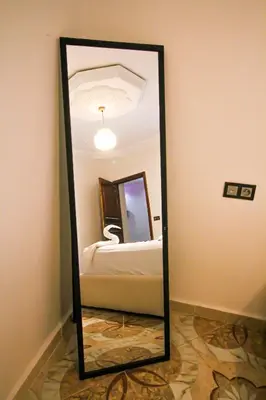 a mirror in the corner of a room at Redmoon Villa & Riad in Marrakech