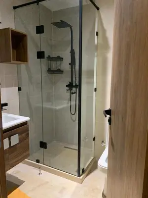 a shower with a glass door in a bathroom at Nejma House - 1 BR with pool in Marrakech