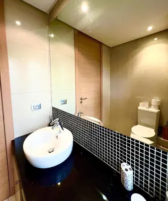 a bathroom with a sink and a toilet at Nice Villa Prestigia golf city marrakech in Marrakech
