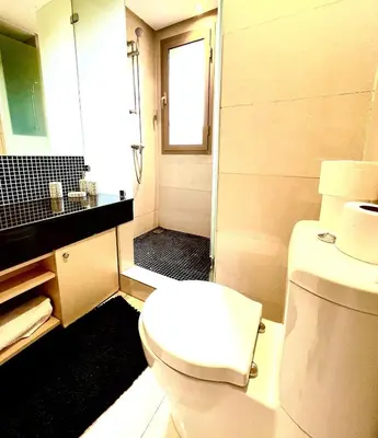a bathroom with a white toilet and a shower at Nice Villa Prestigia golf city marrakech in Marrakech