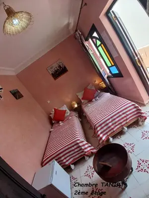 an overhead view of two beds in a room at Riad Dantella in Marrakech