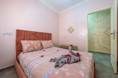 a bedroom with a bed with toys on it at RED YACOUT Parking Sécurisé in Marrakech