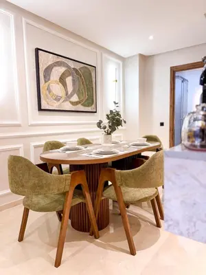 a dining room with a table and chairs at Stylish Escape Modern Comforts in Marrakech