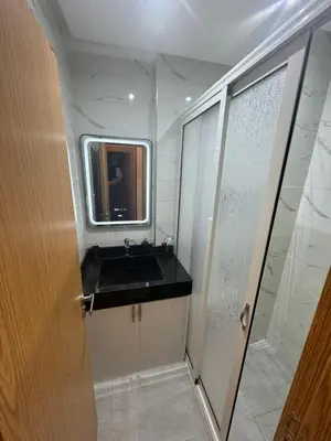 a small bathroom with a sink and a mirror at Piso en Marrakech in Marrakech