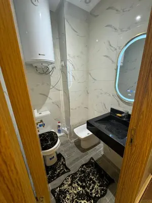 a bathroom with a toilet and a sink at Piso en Marrakech in Marrakech