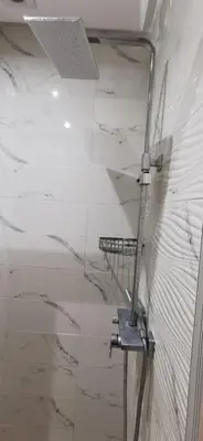 a glass wall with a metal pole in a room at Piso en Marrakech in Marrakech
