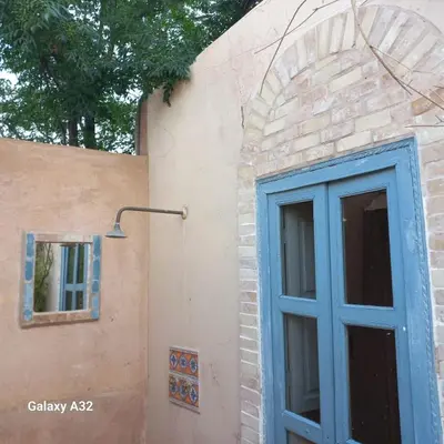 a blue door on the side of a building at villa hibiscus marrakech in Marrakech