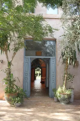 an entrance to a building with trees in front of it at villa hibiscus marrakech in Marrakech