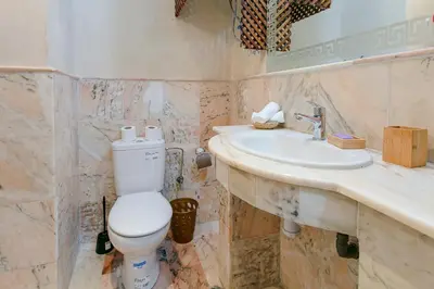 a bathroom with a toilet and a sink at Refuge Peachy Guéliz et Confort in Marrakech