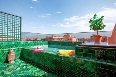 a swimming pool on the roof of a building at Triplex luxe marrakech in Marrakech