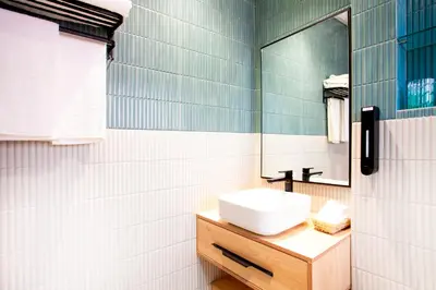 a bathroom with a sink and a mirror at Triplex luxe marrakech in Marrakech
