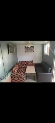 a living room with a couch and a table at Riad 05 in Marrakech
