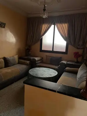 a living room with a couch and a table at dar shahd in Marrakech