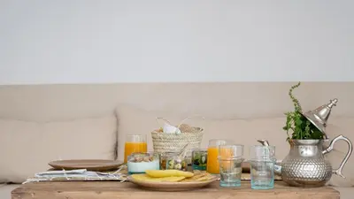 a table with a bunch of glasses of orange juice at Riad Dar Mimi in Marrakech