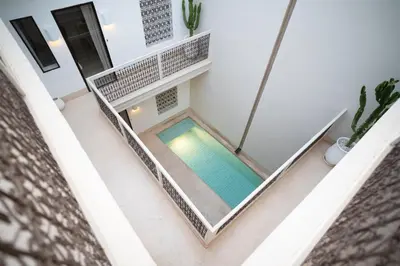 an overhead view of a swimming pool in a house at Riad Dar Mimi in Marrakech