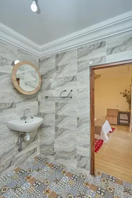 a bathroom with a sink and a mirror at Dar Hma in Marrakech