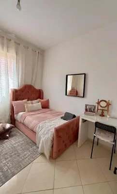 a bedroom with a large bed and a desk at Marrakech stay in Marrakech