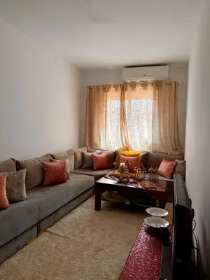 a living room with a couch and a table at Marrakech stay in Marrakech